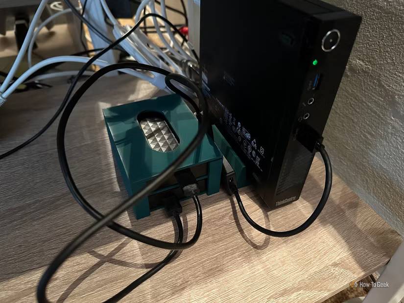 A mini-PC Plex server with 3D printer stand and HDD caddy.