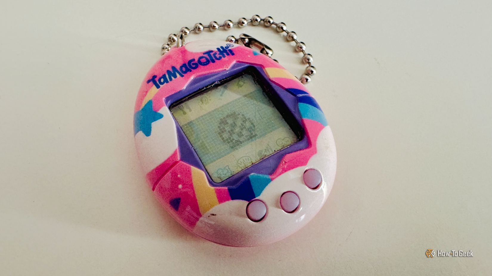 A Tamagotchi on a desk.