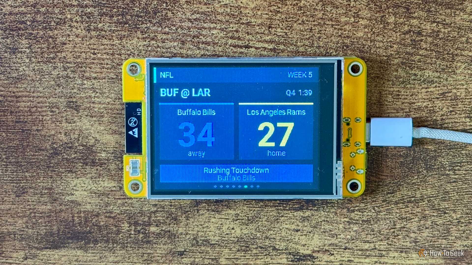 Cheap Yellow Display NFL scoreboard showing Buffalo Bills leading Los Angeles Rams 34 27 late in the fourth quarter after a Rushing Touchdown.
