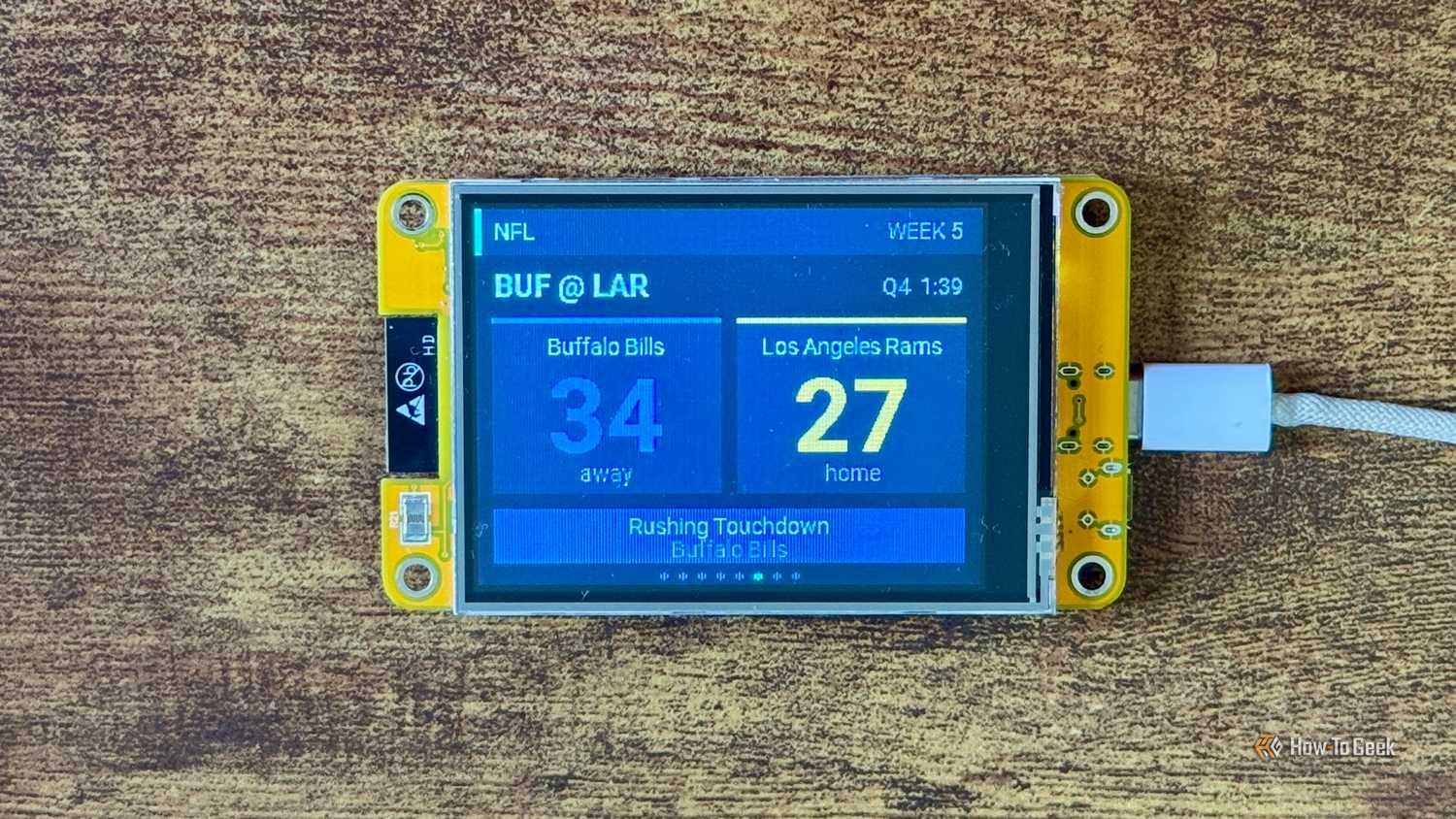 Cheap Yellow Display NFL scoreboard showing Buffalo Bills leading Los Angeles Rams 34 27 late in the fourth quarter after a Rushing Touchdown.