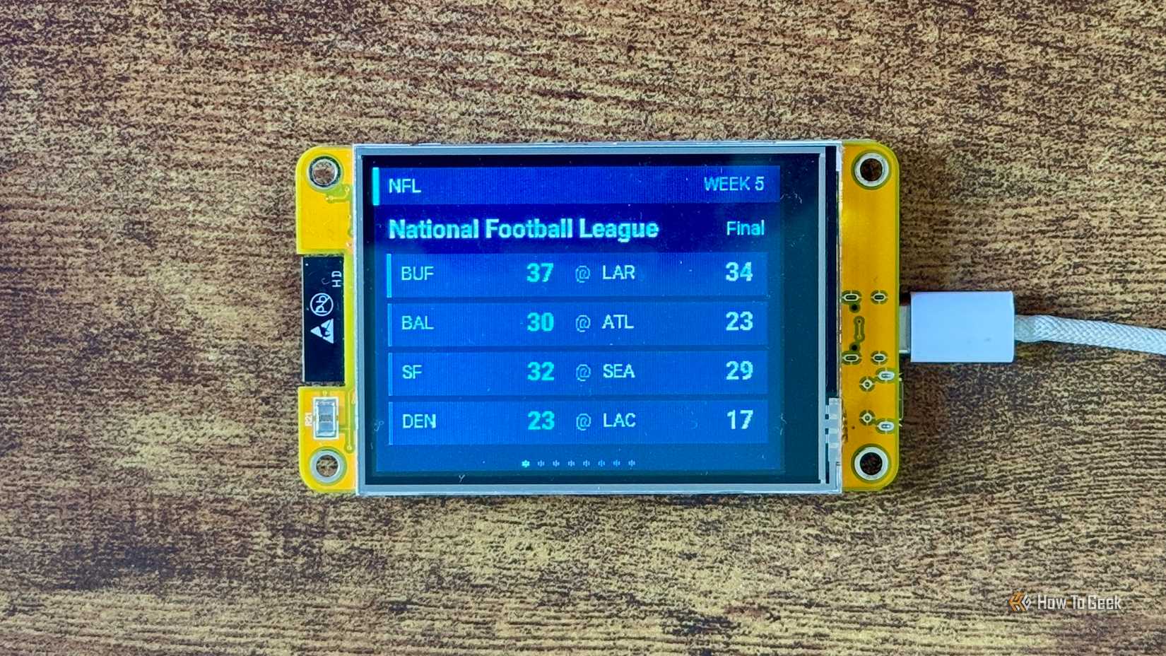 Cheap Yellow Display NFL scoreboard showing Week 5 final scores for Bills Rams Ravens Falcons 49ers Seahawks Broncos and Chargers.