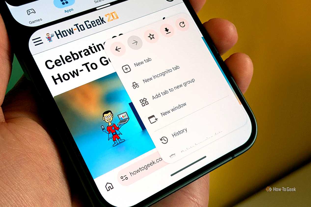 An image of a person holding a phone, with Chrome open, switching between tabs.