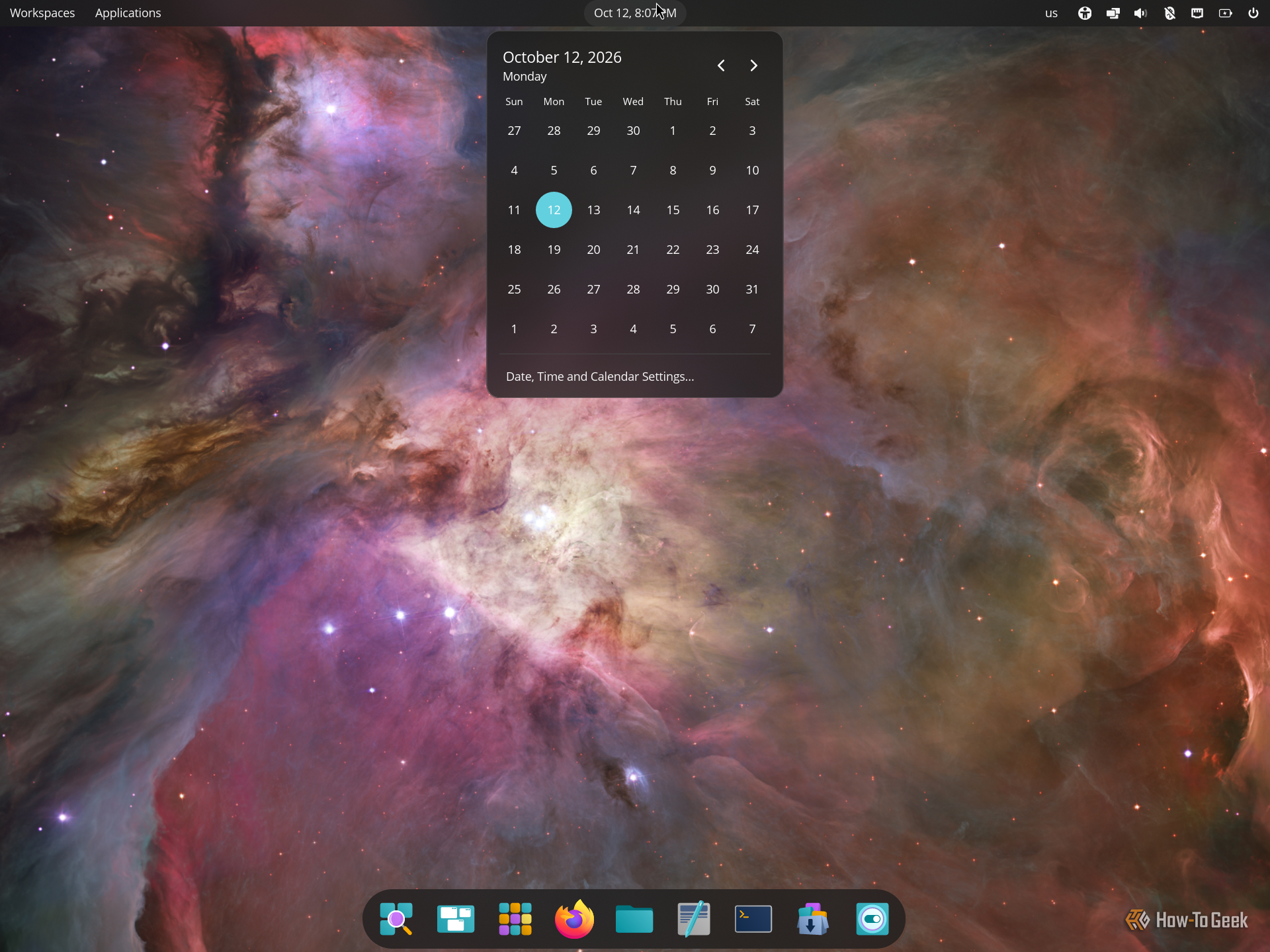 COSMIC calendar dropdown open from the top panel clock showing October 2026.