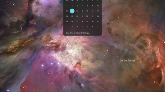 COSMIC calendar dropdown open from the top panel clock showing October 2026.