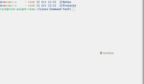 Eza displays a detailed file listing with color-coded permissions, file ownership, modification dates, and directory names arranged beneath column headings.
