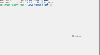 Eza displays a detailed file listing with color-coded permissions, file ownership, modification dates, and directory names arranged beneath column headings.