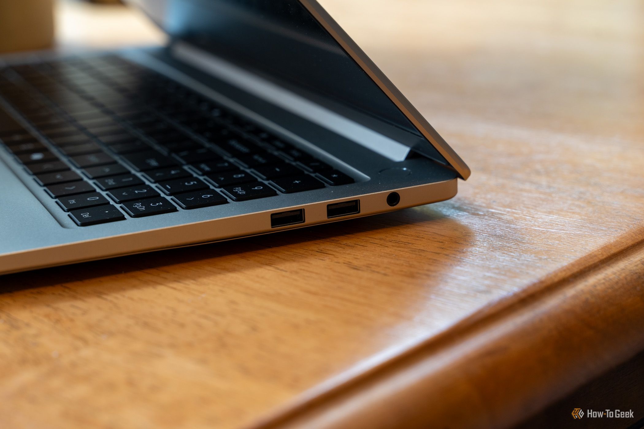 Right side of the GEEKOM GeekBook M16 with two USB-A ports and a headphone jack.