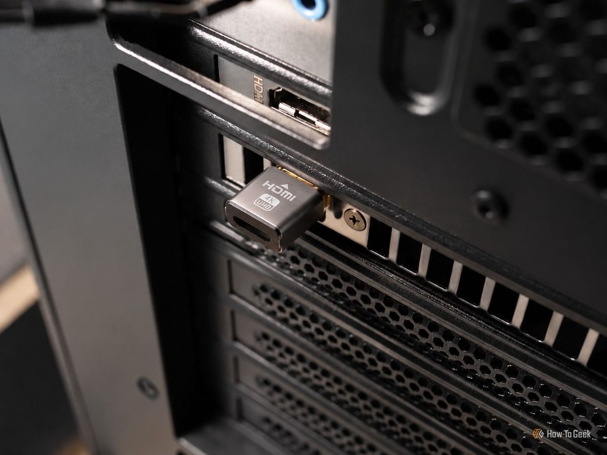 A picture showing Hdmi dummy plug interested in a GPU.