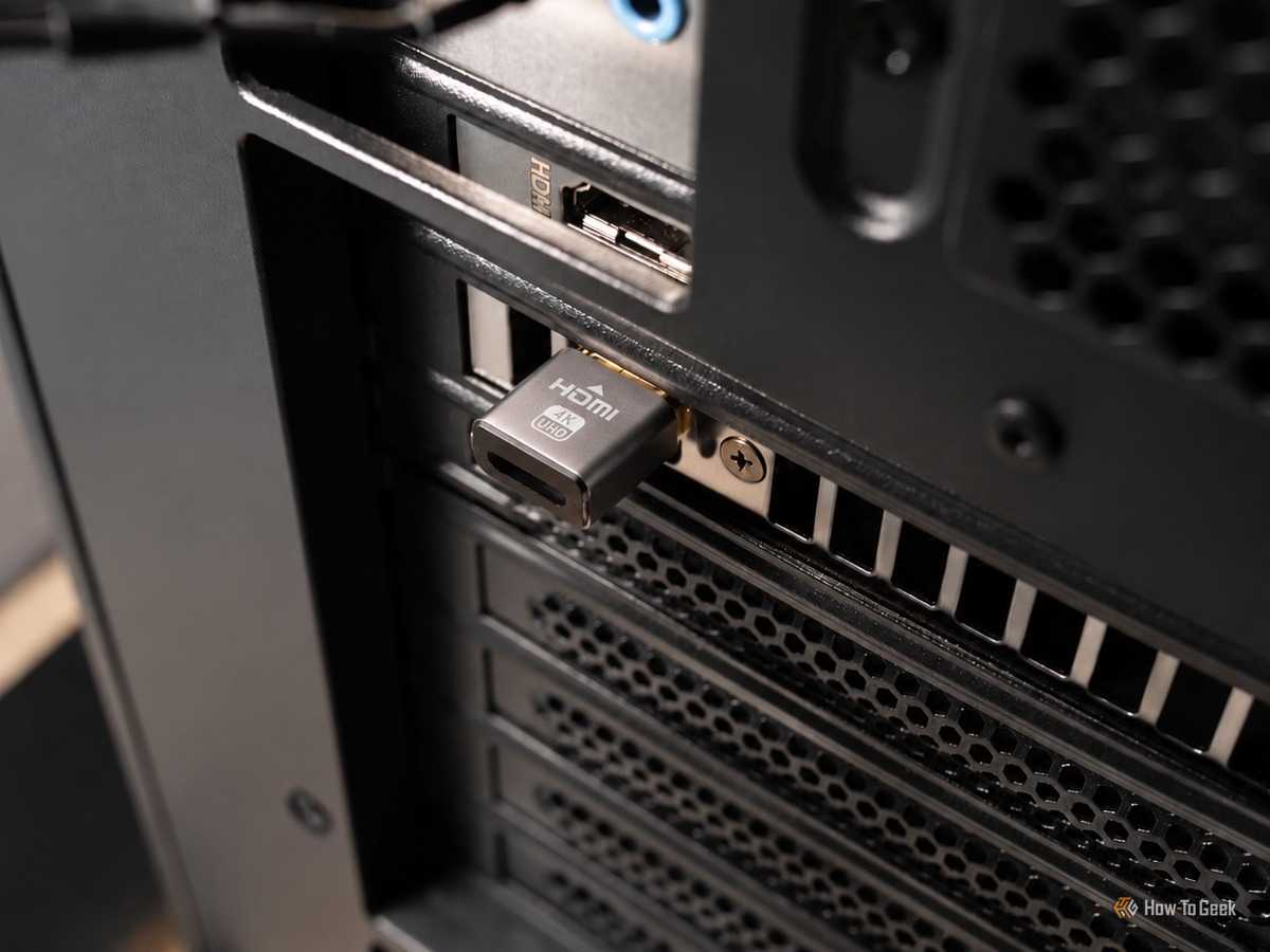 A picture showing Hdmi dummy plug interested in a GPU.