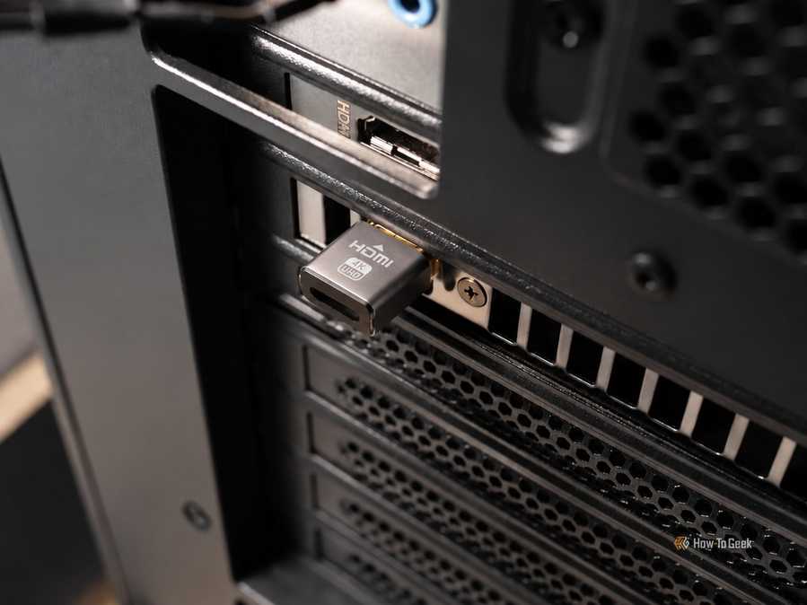 A picture showing Hdmi dummy plug interested in a GPU.