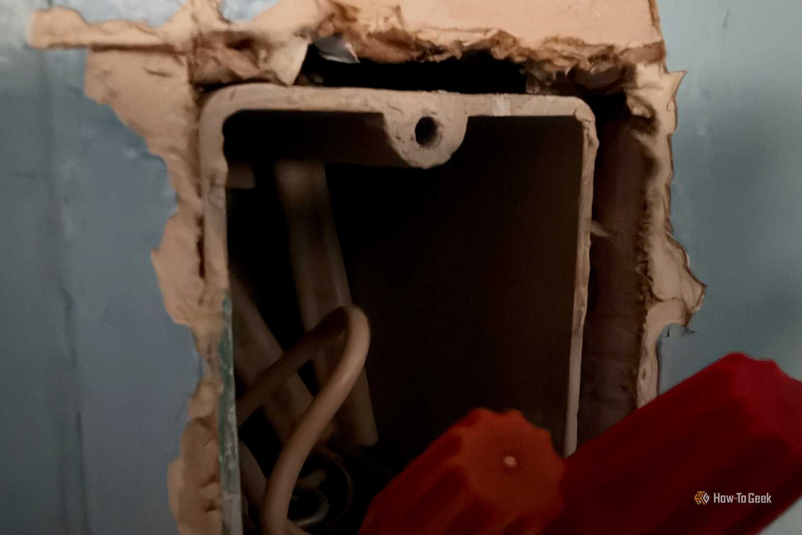 Switch box with wires coming out due to space.