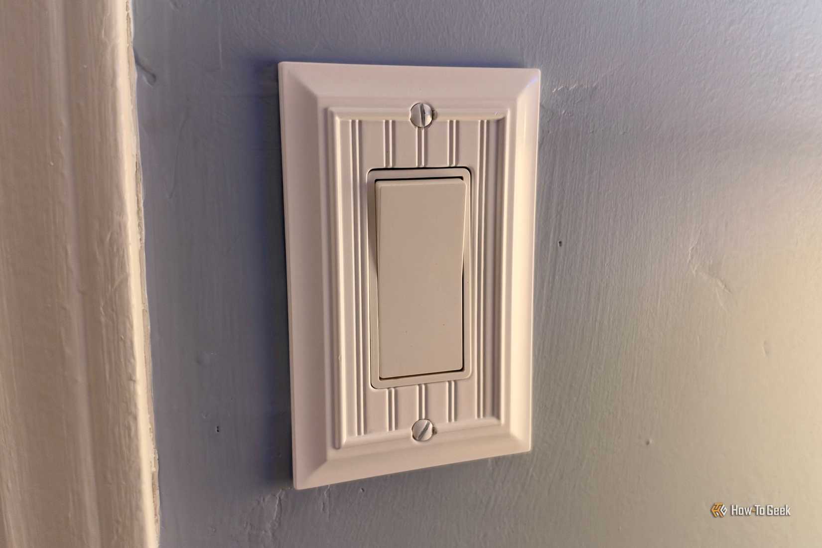 Custom switch plate for a rocker switch.