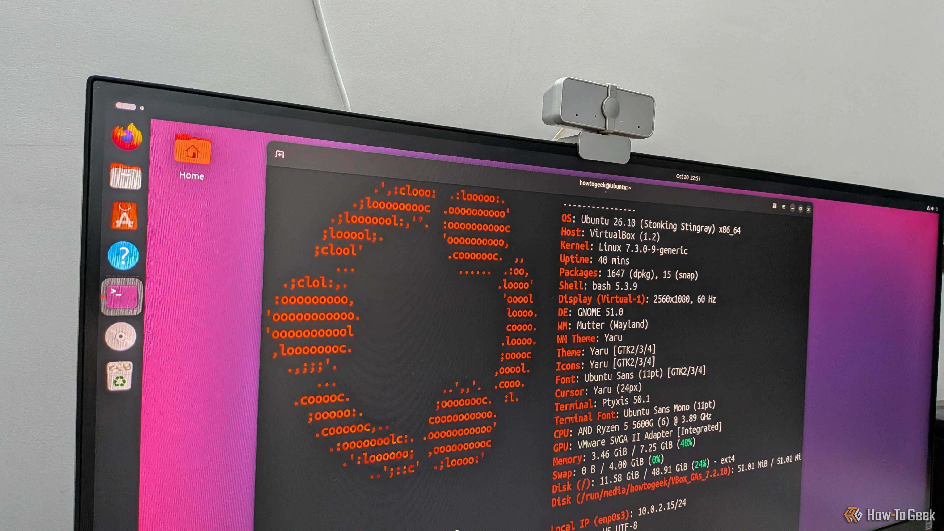 Monitor photo of Ubuntu 26.10 running fastfetch in a terminal, showing Linux kernel 7.3 and GNOME 51.