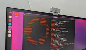 Monitor photo of Ubuntu 26.10 running fastfetch in a terminal, showing Linux kernel 7.3 and GNOME 51.