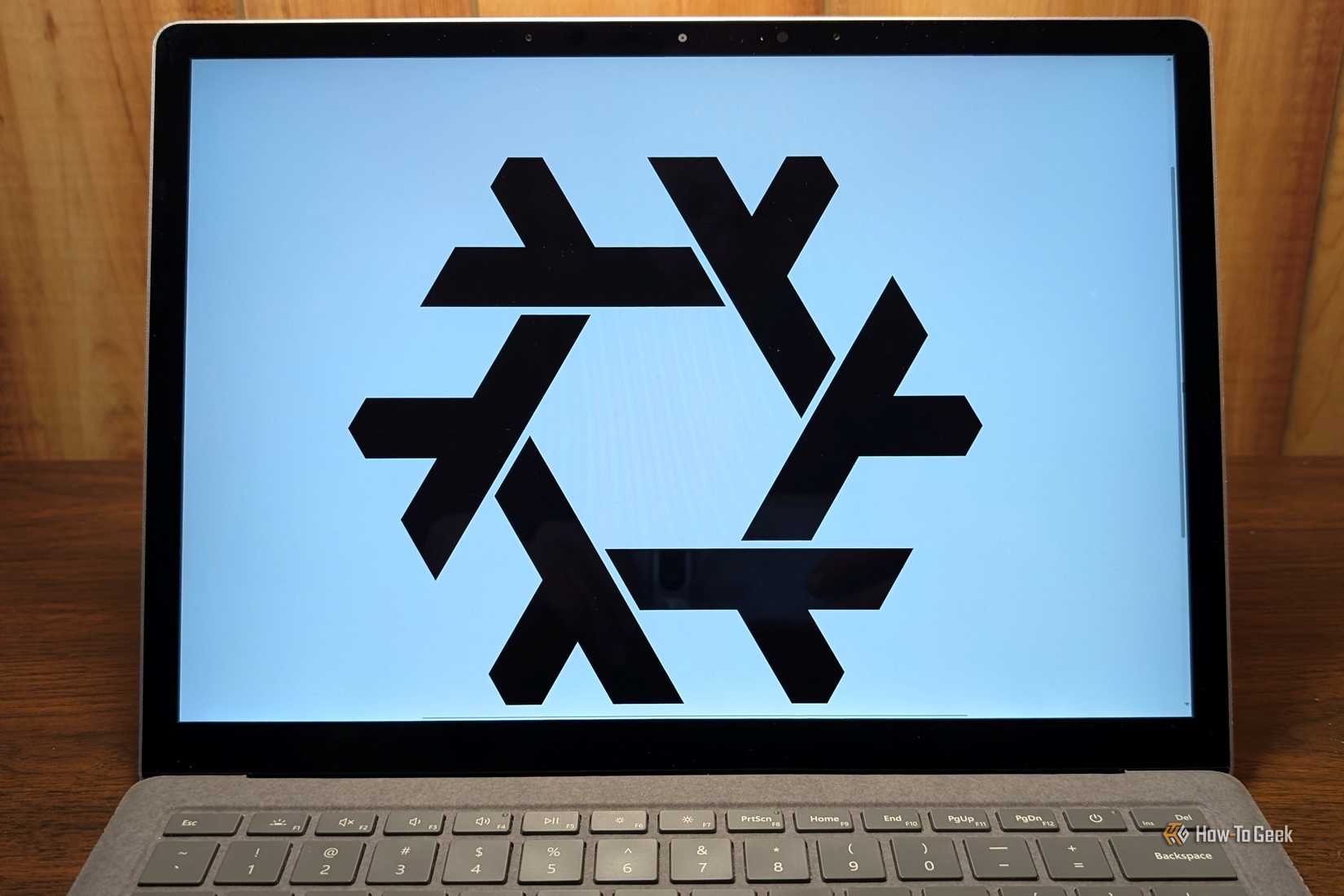 The NixOS logo on a laptop screen. 