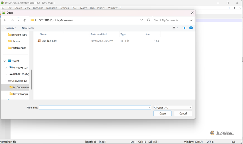 Notepad++ displays a file selection dialog showing a text document stored in the MyDocuments folder on a USB flash drive.