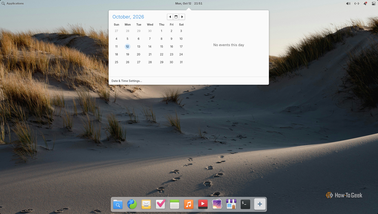 Pantheon calendar dropdown open from the top panel clock showing October 2026 with no events.