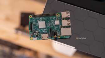 Raspberry Pi 3 Model B resting on a black shelf with its heatsinks and ports visible.