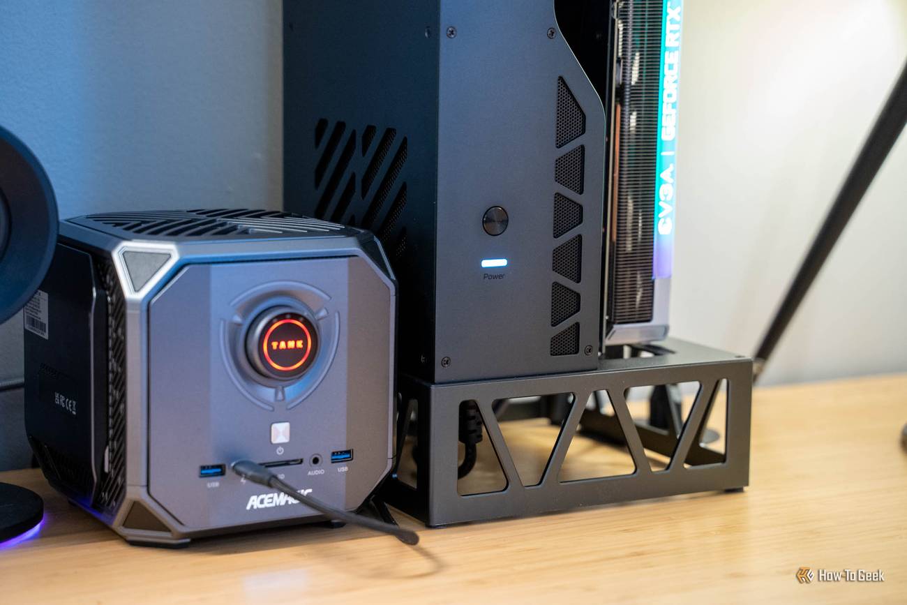 Acemagic Tank mini PC's front ports beside the UGREEN LinkStation eGPU Dock's lit power button.