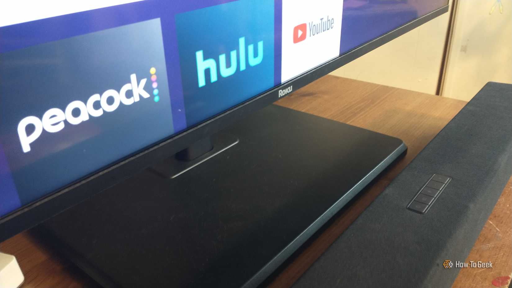 Photo of a Visio soundbar viewed at an angle on the TV stand